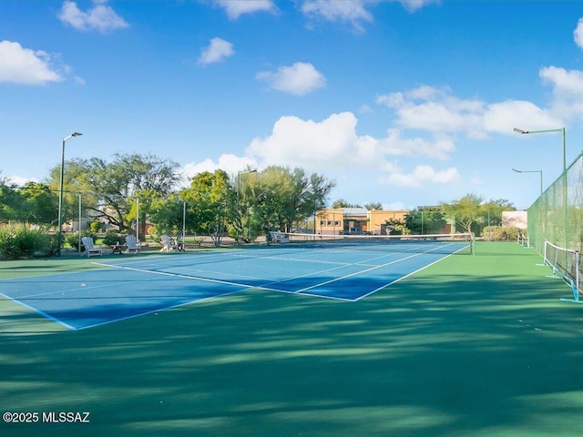view of sport court with fence