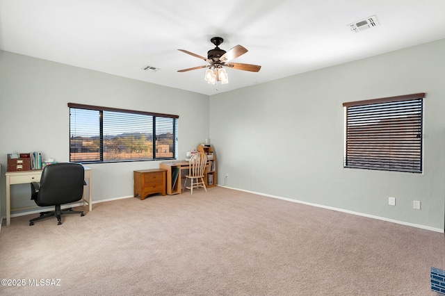 office area featuring ceiling fan, carpet, and visible vents