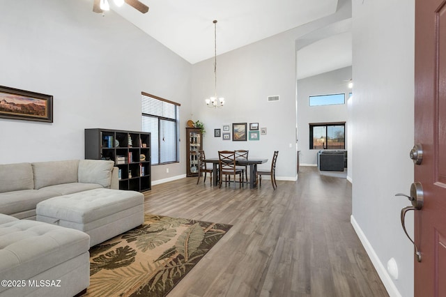 living room with visible vents, high vaulted ceiling, and a healthy amount of sunlight