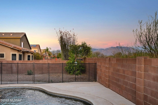 exterior space featuring fence and a fenced in pool