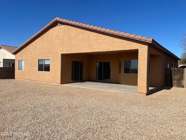 6610 S Via Molino De Viento, Tucson, AZ 85757 - back of house with stucco siding, a patio area, and a tiled roof