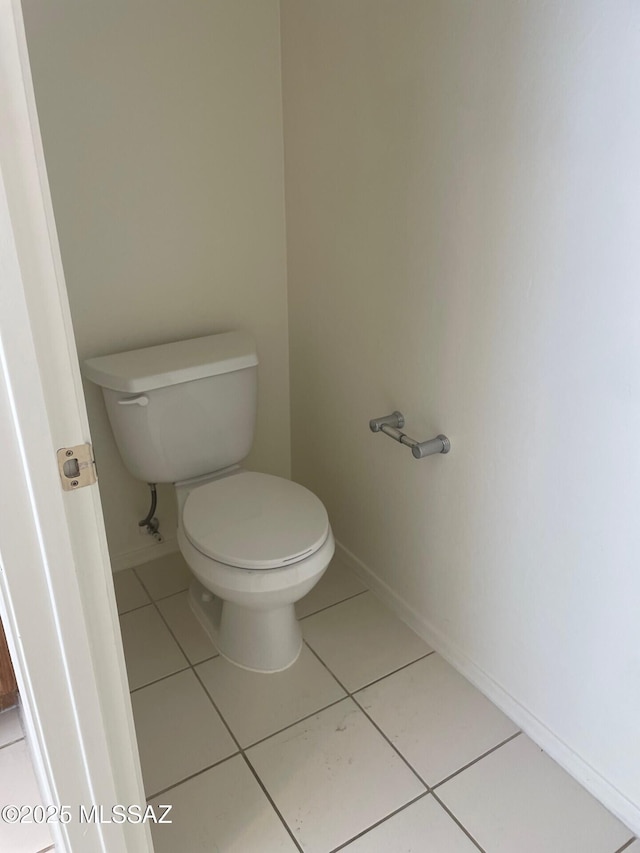 6610 S Via Molino De Viento, Tucson, AZ 85757 - bathroom with baseboards, toilet, and tile patterned flooring