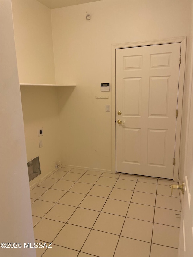 6610 S Via Molino De Viento, Tucson, AZ 85757 - laundry room featuring hookup for an electric dryer, light tile patterned floors, and baseboards