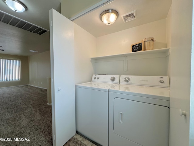 laundry room with separate washer and dryer, laundry area, and visible vents