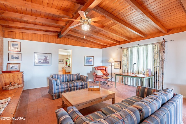 living room featuring lofted ceiling with beams, baseboards, ceiling fan, brick floor, and wood ceiling