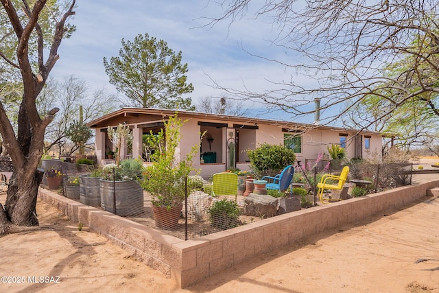 view of front of home featuring stucco siding