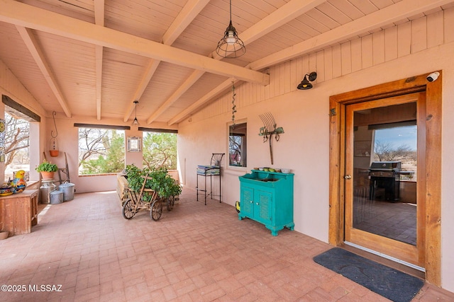 sunroom / solarium with beamed ceiling