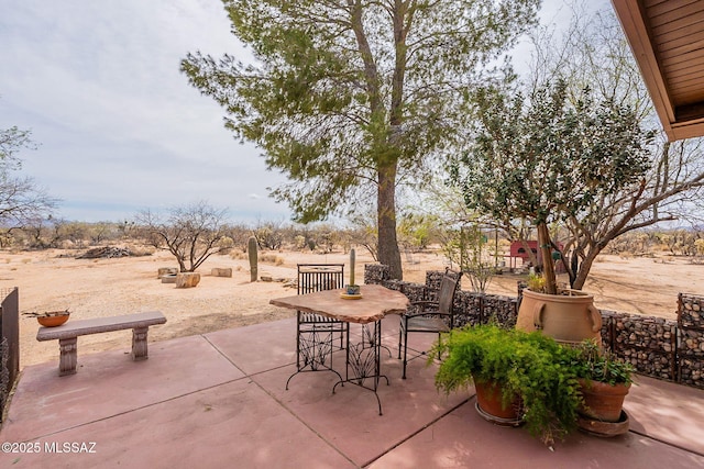 view of patio featuring outdoor dining area