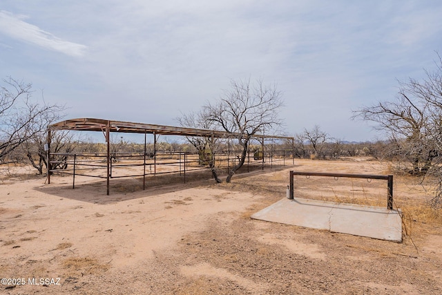 view of yard with an outbuilding and a rural view