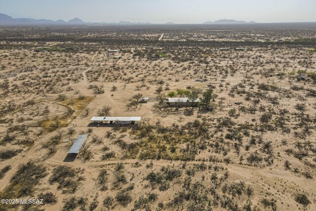 aerial view with a mountain view, a desert view, and a rural view