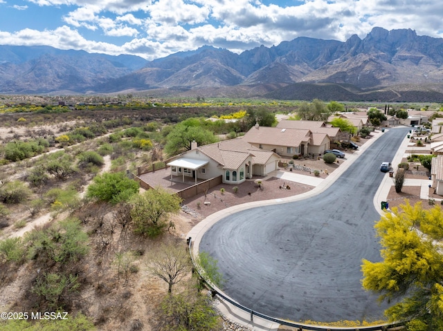 birds eye view of property with a mountain view