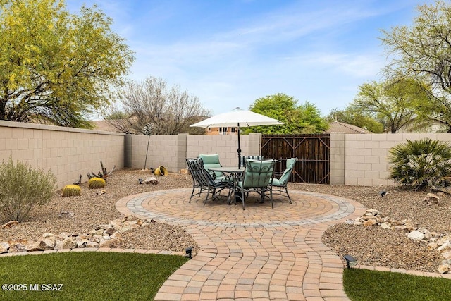 15046 S Harry Truman Pl, Sahuarita, AZ 85629 - fenced backyard with a patio area and outdoor dining space