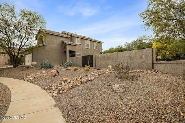 15046 S Harry Truman Pl, Sahuarita, AZ 85629 - view of side of property featuring stucco siding and a tiled roof