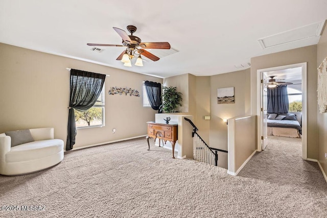 15046 S Harry Truman Pl, Sahuarita, AZ 85629 - living area with carpet floors, healthy amount of natural light, an upstairs landing, and a ceiling fan