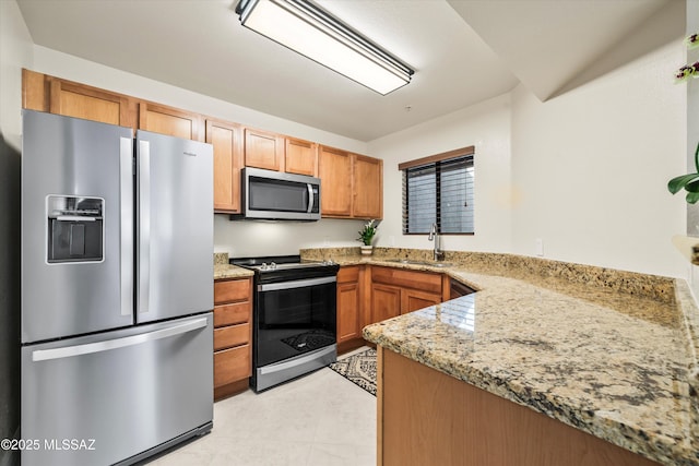 5751 N Kolb Rd Unit 2101, Tucson, AZ 85750 - kitchen featuring stainless steel appliances, a sink, light stone counters, and light tile patterned floors