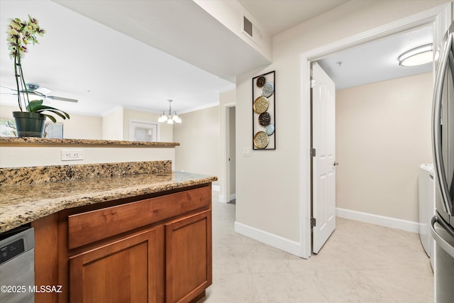 5751 N Kolb Rd Unit 2101, Tucson, AZ 85750 - kitchen with brown cabinets, a chandelier, light stone countertops, ornamental molding, and baseboards