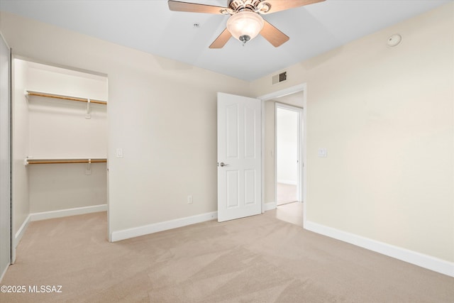 5751 N Kolb Rd Unit 2101, Tucson, AZ 85750 - unfurnished bedroom featuring carpet, a closet, a spacious closet, and baseboards