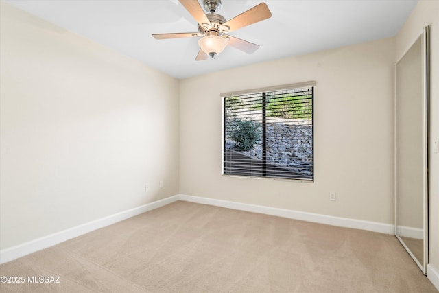 5751 N Kolb Rd Unit 2101, Tucson, AZ 85750 - spare room with light colored carpet, baseboards, and ceiling fan