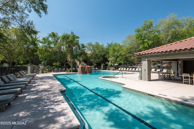 5751 N Kolb Rd Unit 2101, Tucson, AZ 85750 - community pool featuring a patio and view of scattered trees