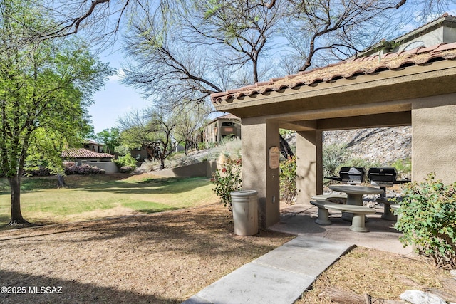 5751 N Kolb Rd Unit 2101, Tucson, AZ 85750 - view of grassy yard with a patio area