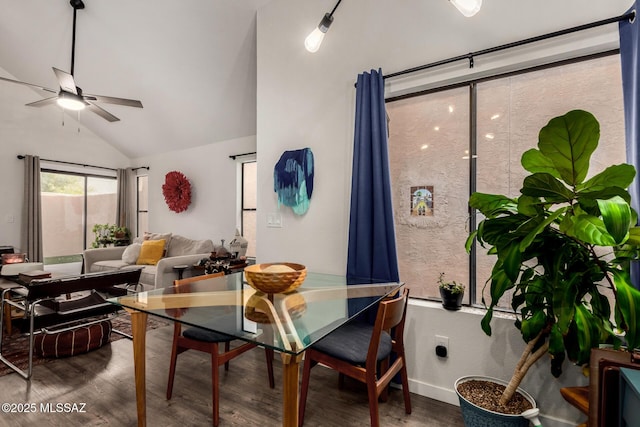 dining space featuring vaulted ceiling, wood finished floors, and a ceiling fan