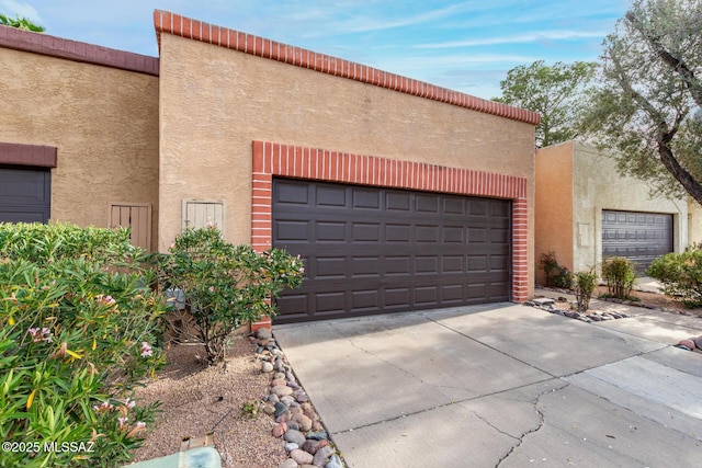 garage featuring driveway