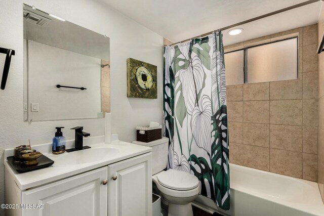 bathroom featuring shower / bath combination with curtain, toilet, vanity, and visible vents