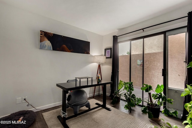 office featuring baseboards and wood finished floors