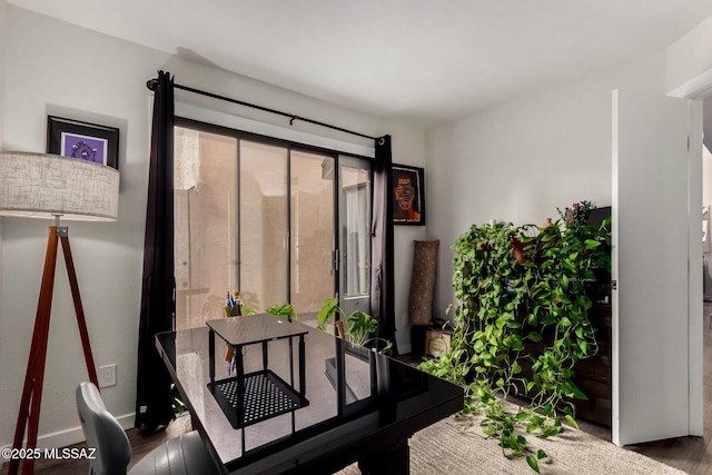 office featuring baseboards and wood finished floors