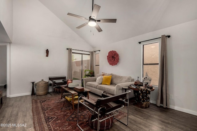 living room with baseboards, high vaulted ceiling, wood finished floors, and a ceiling fan