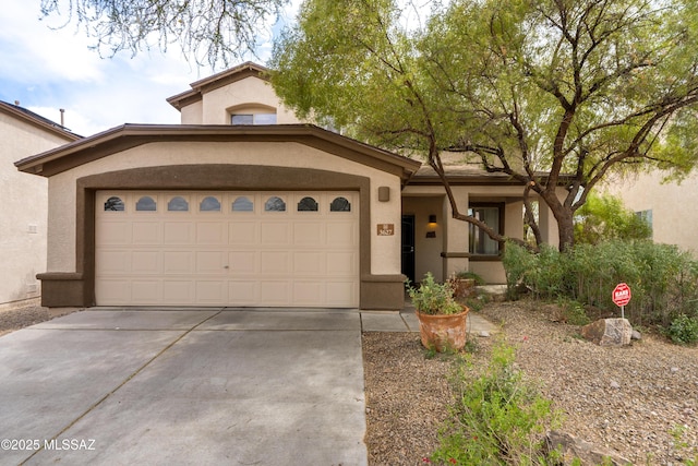 view of front of house featuring driveway and stucco siding