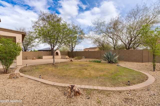 view of yard featuring a patio and a fenced backyard