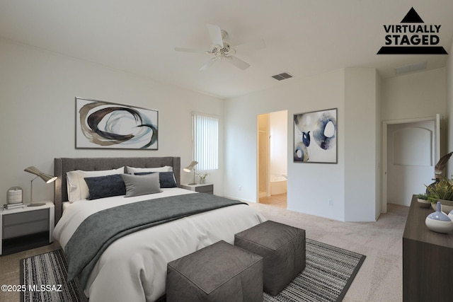 carpeted bedroom with ensuite bathroom, ceiling fan, and visible vents