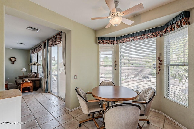 dining area featuring visible vents, a ceiling fan, and a healthy amount of sunlight