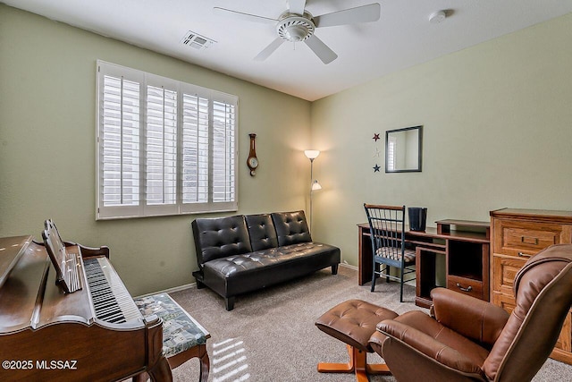 office area featuring baseboards, visible vents, ceiling fan, and carpet flooring