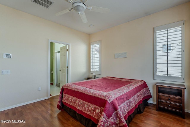 bedroom with baseboards, visible vents, a ceiling fan, and wood finished floors