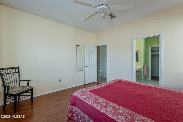 bedroom with visible vents, baseboards, and dark wood finished floors