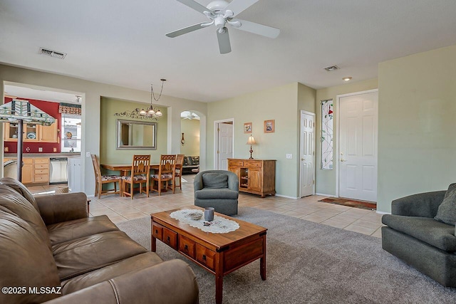 living room featuring a ceiling fan, light tile patterned floors, and visible vents