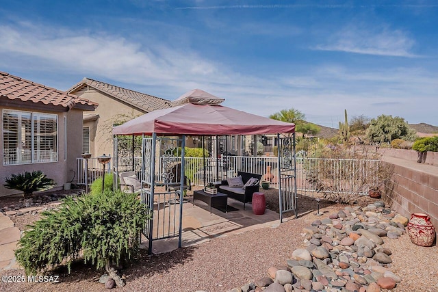 view of yard with an outdoor hangout area, a gazebo, fence, and a patio area