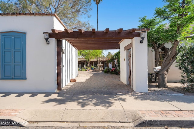 view of parking / parking lot featuring a carport and driveway
