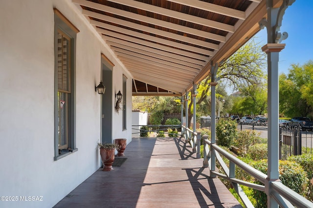 view of patio / terrace with covered porch and fence