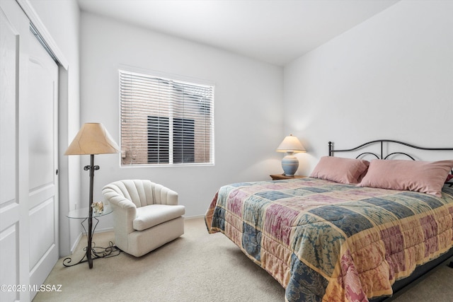 bedroom with a closet, carpet floors, and baseboards