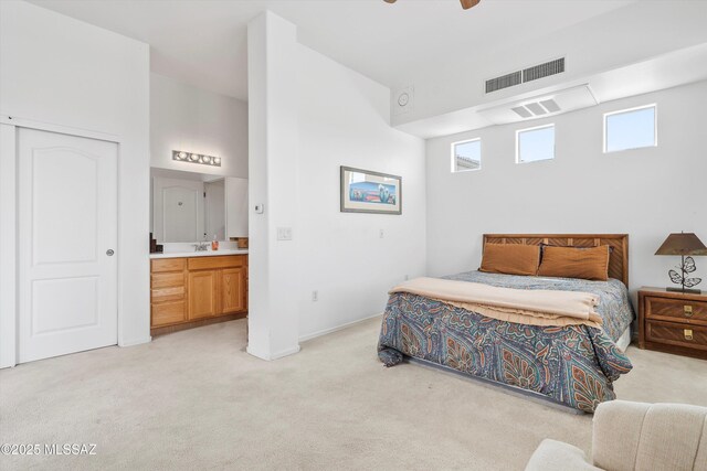 bedroom featuring light carpet, baseboards, ceiling fan, and visible vents