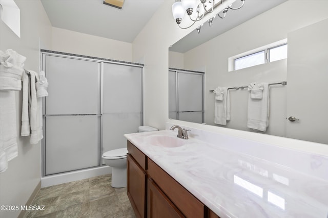 full bath with a chandelier, toilet, vanity, and an enclosed shower