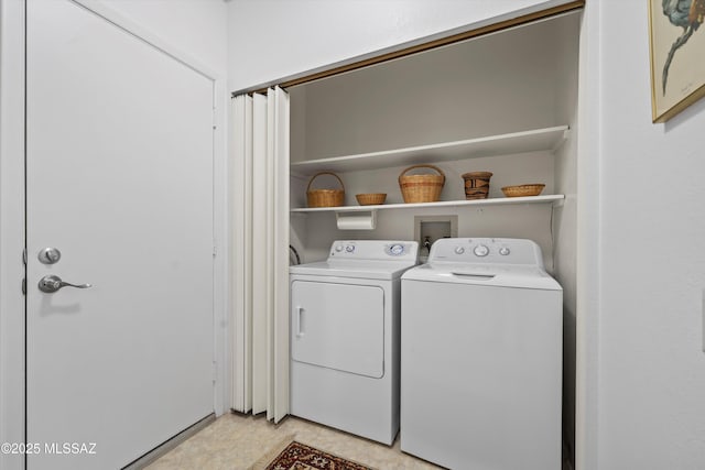 laundry area with washing machine and clothes dryer and laundry area