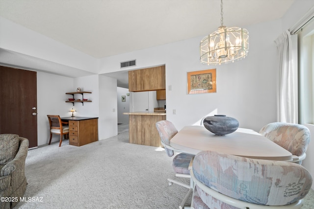 dining area with visible vents, a chandelier, and light carpet