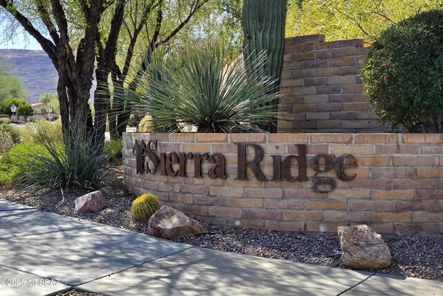 community sign featuring a mountain view