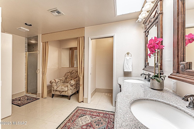 full bath with visible vents, marble finish floor, a sink, and a stall shower