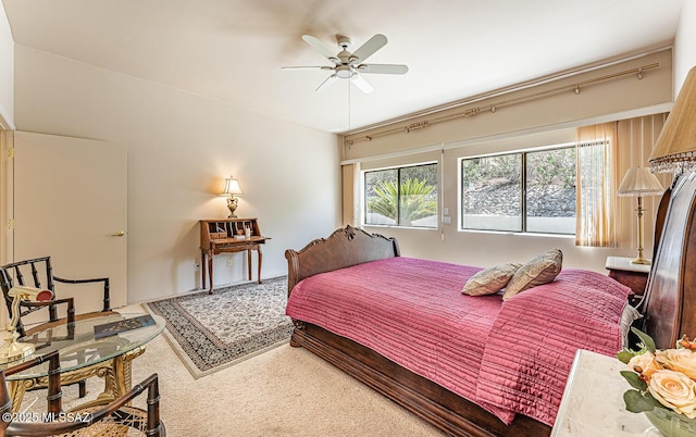 carpeted bedroom featuring a ceiling fan