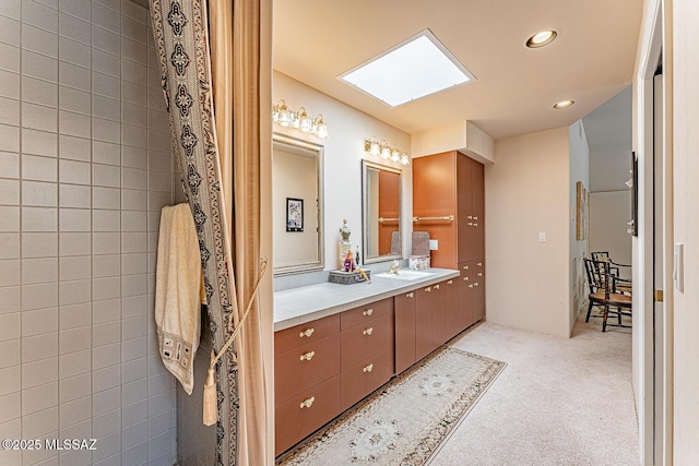 bathroom with vanity and recessed lighting